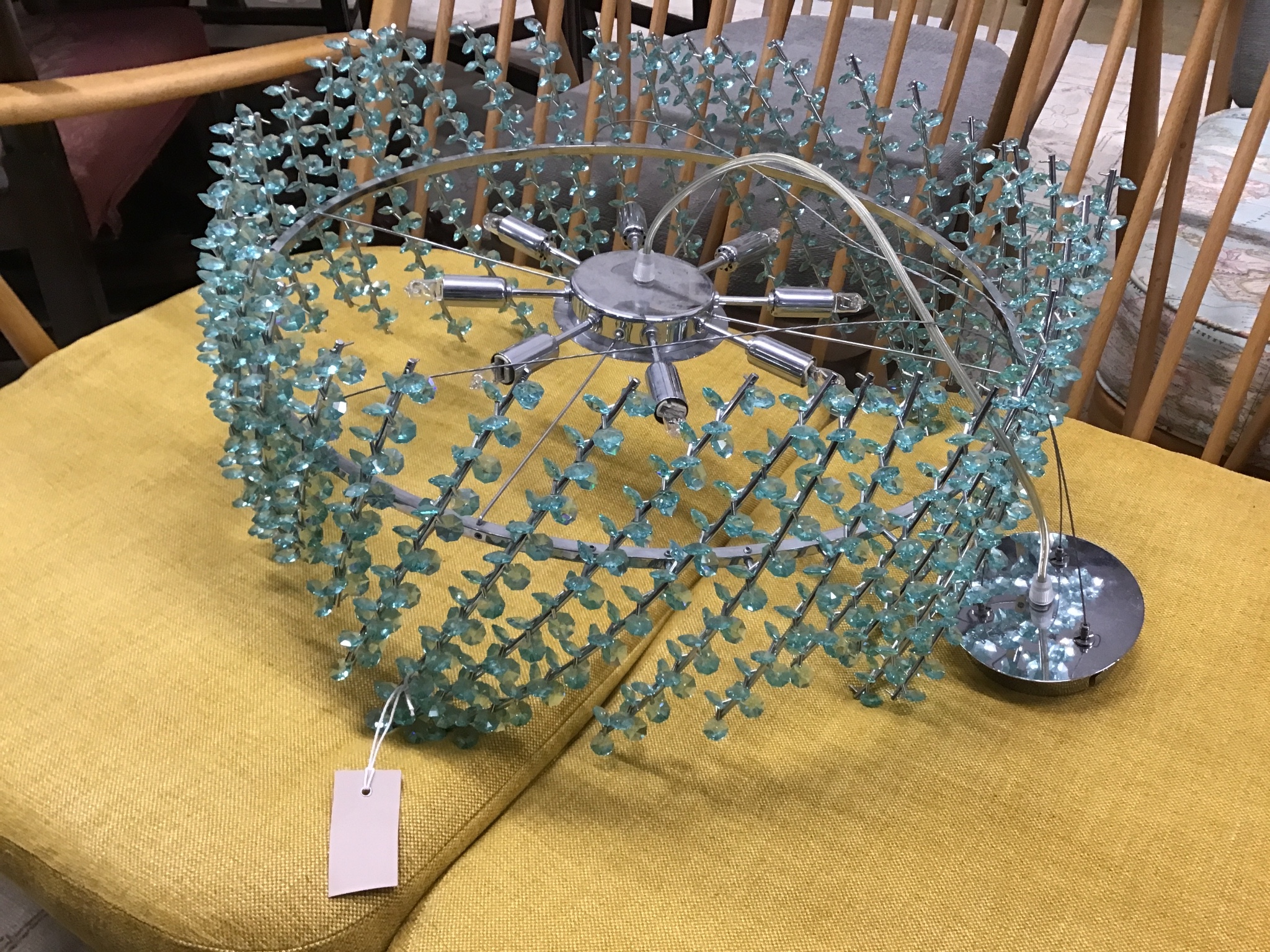 A contemporary ceiling light with faceted green glass beads, diameter 55cms.